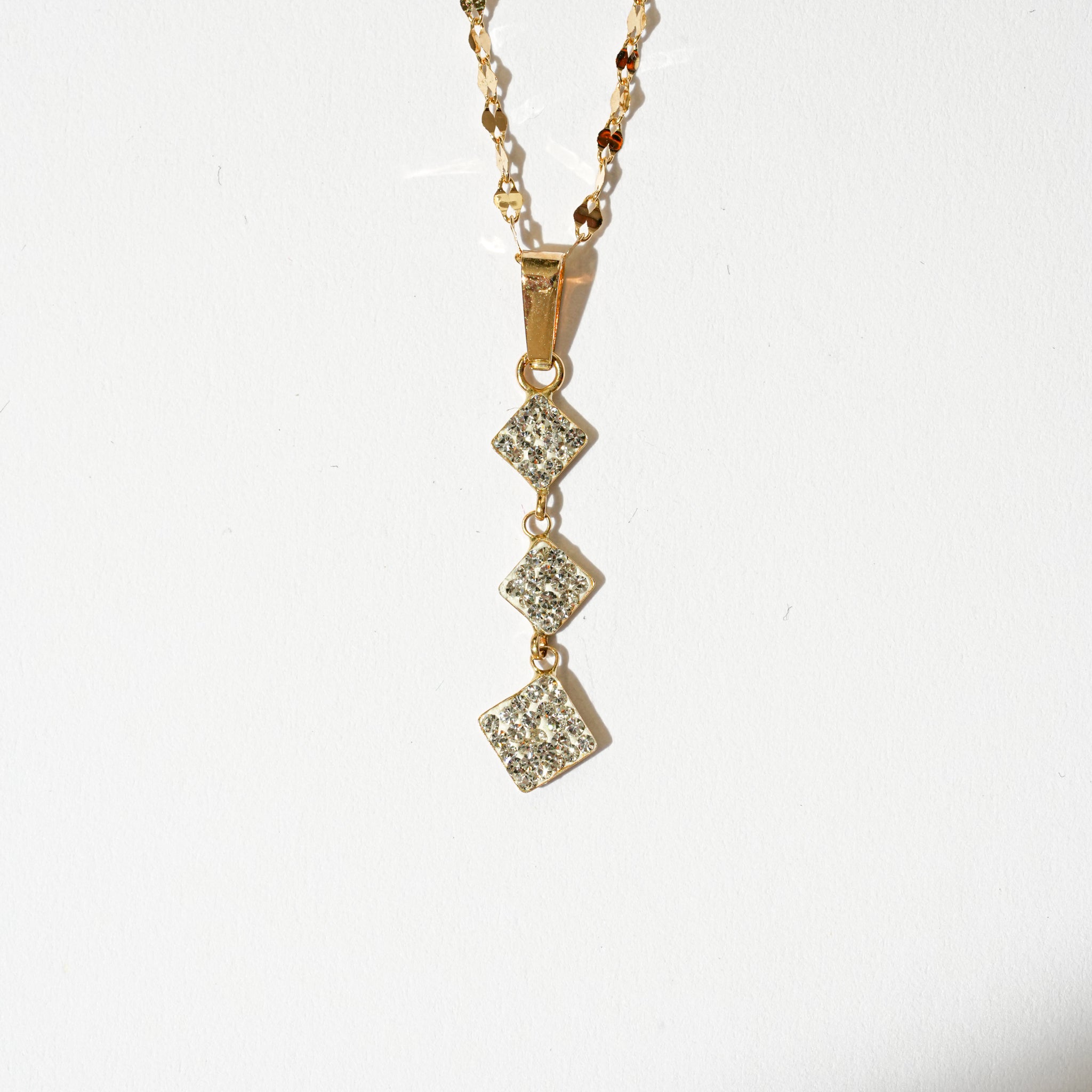 Collana trilogy con zirconi in oro 18kt