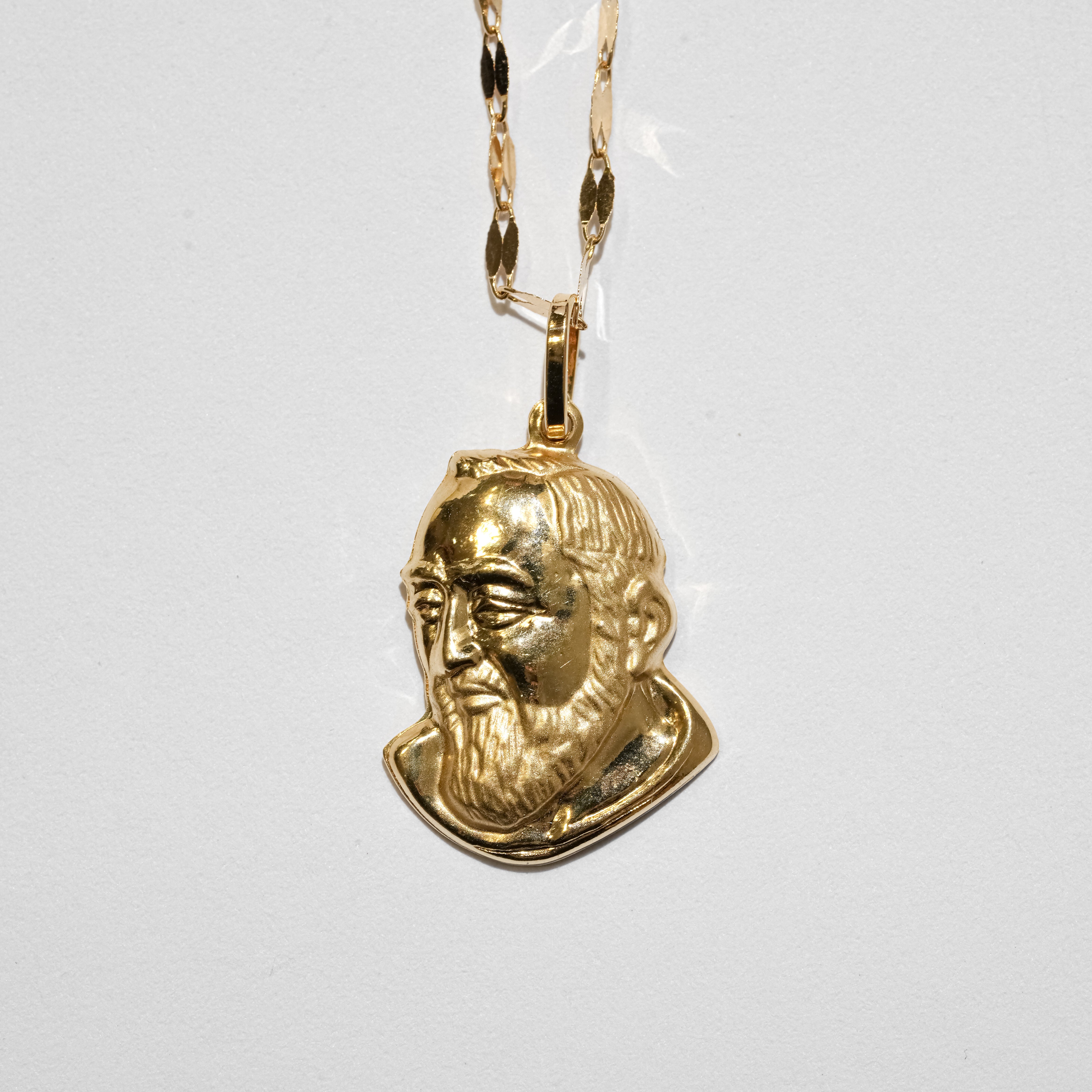 Collana con volto in oro 18Kt